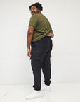 Men wearing a kaki t-shirt and black cargo pants | Wide the Brand | Cargo pants | Black