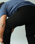 Wide the Brand | Men wearing a pair of black stretch pull-up plus size work trousers