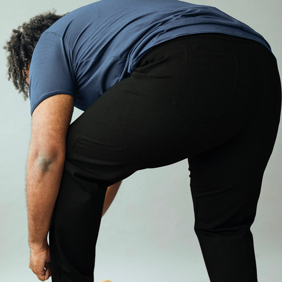 Wide the Brand | Men wearing a pair of black stretch pull-up plus size work trousers