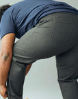 Wide the Brand | Men wearing a pair of dark grey stretch pull-up plus size work trousers